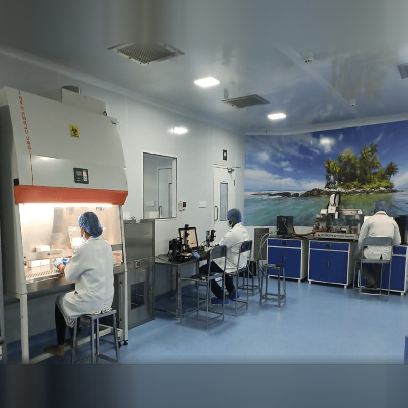 Researchers working in the Bio Valley clean-room laboratory with a biosafety cabinet and 3D bioplotter
