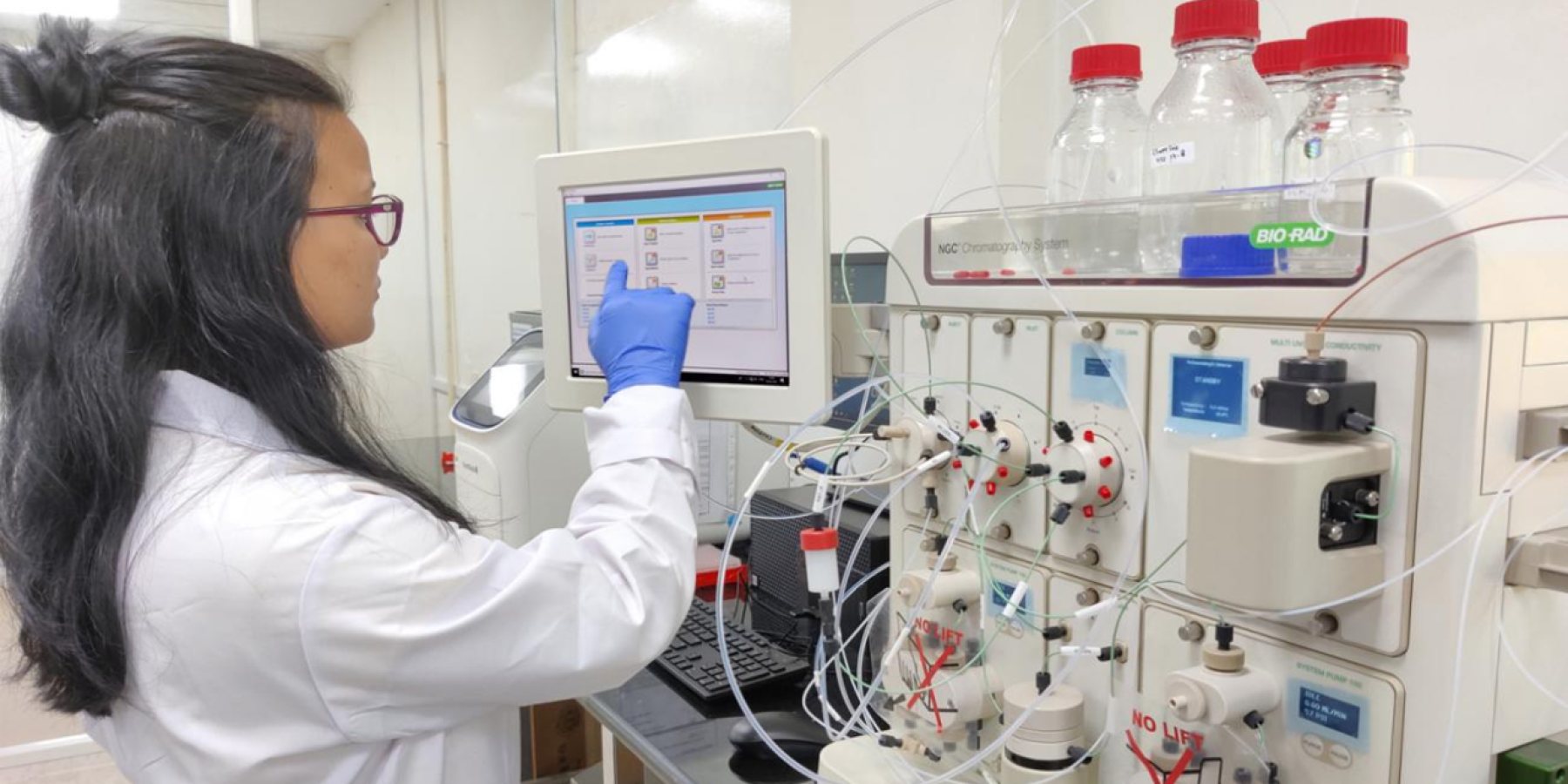 Scientist operating a chromatography system in a Bio Valley lab